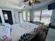 Bedroom with a queen bed, coastal decor and access to a private balcony at 6001 - 6004 S Kings Hwy., Myrtle Beach, SC 29575