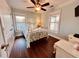 Bedroom with a twin bed, coastal decor, and plenty of natural light at 6001 - 6004 S Kings Hwy., Myrtle Beach, SC 29575