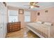 Bedroom with a king-size bed, dresser, and ceiling fan at 601 37Th Ave. N # C, Myrtle Beach, SC 29577