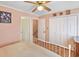 Bedroom with king-size bed, ceiling fan, and access to hallway and bathroom at 601 37Th Ave. N # C, Myrtle Beach, SC 29577