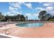 Inviting community pool with plenty of lounge chairs and tables at 604 Ellis Dr., Conway, SC 29526