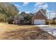 Brick home with two-car garage and landscaped lawn at 604 Ellis Dr., Conway, SC 29526