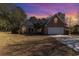 Brick home with a two-car garage at dusk at 604 Ellis Dr., Conway, SC 29526