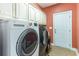 Laundry room with washer, dryer, and built-in cabinets at 604 Ellis Dr., Conway, SC 29526