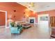 Living room with tile floors, fireplace, and green armchair at 604 Ellis Dr., Conway, SC 29526