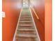 Carpeted staircase with wood handrail at 604 Ellis Dr., Conway, SC 29526