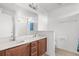 Double vanity bathroom with a large mirror at 605 West Perry Rd., Myrtle Beach, SC 29579