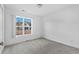 Empty bedroom with large window and neutral walls at 605 West Perry Rd., Myrtle Beach, SC 29579