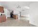 Kitchen with dark brown cabinets, black appliances, and tile floor at 605 West Perry Rd., Myrtle Beach, SC 29579