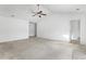 Open living space with carpet, ceiling fan, and access to other rooms at 605 West Perry Rd., Myrtle Beach, SC 29579