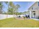 Landscaped backyard with fire pit and seating area at 623 Meadowgrass Ct., Myrtle Beach, SC 29588