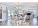 Elegant dining area with a table and bench seating for four, overlooking the backyard at 623 Meadowgrass Ct., Myrtle Beach, SC 29588