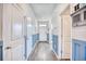 Inviting entryway with light gray and blue wainscoting and hardwood floors at 623 Meadowgrass Ct., Myrtle Beach, SC 29588