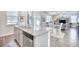 Kitchen island with granite countertop, stainless steel dishwasher, and open-concept layout at 623 Meadowgrass Ct., Myrtle Beach, SC 29588