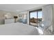 Main bedroom with ocean view, white wicker chair, and king-size bed at 645 Sandpiper Run Retreat Beach Circle, Pawleys Island, SC 29585