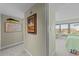 Hallway with artwork and a view into a bedroom with twin beds at 645 Sandpiper Run Retreat Beach Circle, Pawleys Island, SC 29585