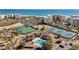 Aerial view of tennis courts and pools near beach at 645 Sandpiper Run Retreat Beach Circle, Pawleys Island, SC 29585