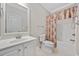 Bathroom with tub shower and white vanity at 65 Harbourreef Dr., Pawleys Island, SC 29585