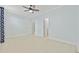 Spacious bedroom with tile floors and ceiling fan at 65 Harbourreef Dr., Pawleys Island, SC 29585