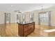 Bright dining area with hardwood floors and a large chandelier at 65 Harbourreef Dr., Pawleys Island, SC 29585