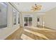 Sunlit Gathering room with hardwood floors and sliding glass doors to deck at 65 Harbourreef Dr., Pawleys Island, SC 29585