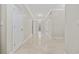 Light-filled hallway with tile floors and access to other rooms at 65 Harbourreef Dr., Pawleys Island, SC 29585