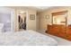 Bedroom with a king-size bed, dresser, and walk-in closet at 6925 Ashley Cove Dr., Myrtle Beach, SC 29588