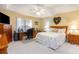 Spacious bedroom with a king-size bed, desk, and ample closet space at 6925 Ashley Cove Dr., Myrtle Beach, SC 29588