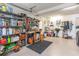 Well-organized garage workshop with ample storage shelving and workbench at 6925 Ashley Cove Dr., Myrtle Beach, SC 29588