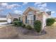 Brick house exterior showcasing a large arched window at 6925 Ashley Cove Dr., Myrtle Beach, SC 29588