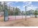 Community tennis court with chain link fence at 6925 Ashley Cove Dr., Myrtle Beach, SC 29588