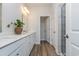 Modern bathroom featuring a double vanity, sleek fixtures, and a glass-enclosed shower at 705 Choctaw Dr., Conway, SC 29526