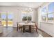 Bright dining room featuring a round table, decorative rug, and views of the outdoor scenery at 705 Choctaw Dr., Conway, SC 29526