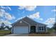 Charming single-story home with a two-car garage, neutral siding, and a well-manicured lawn at 705 Choctaw Dr., Conway, SC 29526