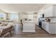 Open kitchen layout with white cabinets, stainless appliances, a large island and hardwood floors throughout at 705 Choctaw Dr., Conway, SC 29526