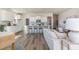 Open-concept kitchen with white cabinets, stainless steel appliances, and a breakfast bar with seating at 705 Choctaw Dr., Conway, SC 29526