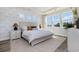 Comfortable bedroom with leafy wallpaper, offering a view of the outdoors and serene natural light at 705 Choctaw Dr., Conway, SC 29526