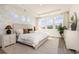Comfortable bedroom with leafy wallpaper, offering a view of the outdoors and serene natural light at 705 Choctaw Dr., Conway, SC 29526