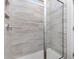 Spa-like shower featuring neutral tiling, a glass enclosure, and modern fixtures at 705 Choctaw Dr., Conway, SC 29526