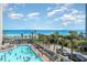 Large pool area with ocean views and many lounge chairs at 7100 N Ocean Blvd. # 320, Myrtle Beach, SC 29572