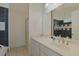 Bathroom with single sink vanity, shower, and black and white tile at 7570 Johnson Rd., Myrtle Beach, SC 29588