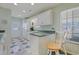 Kitchen with white cabinets, green countertops, and tile floor at 7570 Johnson Rd., Myrtle Beach, SC 29588