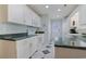 Well-equipped kitchen featuring white cabinets and green countertops at 7570 Johnson Rd., Myrtle Beach, SC 29588