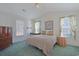 Main bedroom with a comfortable bed and plenty of natural light at 7570 Johnson Rd., Myrtle Beach, SC 29588