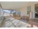 Relaxing screened porch with seating and a hammock at 7570 Johnson Rd., Myrtle Beach, SC 29588