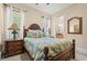 Bright guest bedroom with a comfortable bed and en-suite bathroom at 8058 Verona Dr., Myrtle Beach, SC 29572