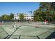 Tennis courts with people playing and a building in the background at 8058 Verona Dr., Myrtle Beach, SC 29572