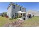 Large backyard featuring a covered patio area and a well-maintained lawn at 817 Old Castle Loop, Myrtle Beach, SC 29579