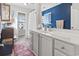 Bathroom with gray cabinets, white countertop, and a shower/tub combo at 817 Old Castle Loop, Myrtle Beach, SC 29579