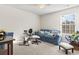 Bedroom with a blue couch and exercise equipment at 817 Old Castle Loop, Myrtle Beach, SC 29579